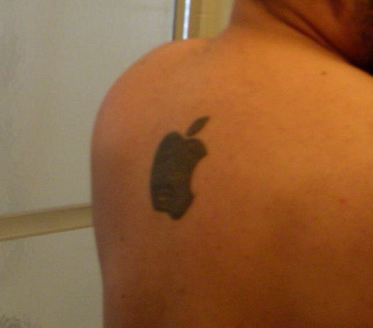 Listener Russ sent in tis picture of his Apple Logo tattoo.